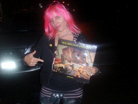 Chelsea Rose Holding The New
Housecoat Project LP