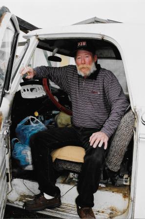 Jack Kerouac’s nephew Paul Blake, Jr., living in his broken pickup truck in a Sacramento junkyard, October, 2001. Photo by Gerald Nicosia.