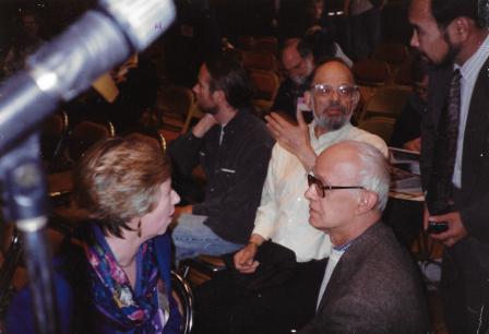 John Sampas (right), talks to Helen Kelly, program director of NYU during the Beat Generation conference in May 1994.  Poet Allen Ginsberg is just behind Sampas.  Sampas became executor of Kerouac&rsquo;s literary properties after his sister Stella, Jack&rsquo;s widow, bequeathed Kerouac&rsquo;s estate to her brothers and sisters in 1990.  Photo by John Paul Pirolli.